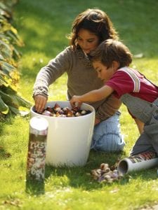 chidren planting bulbs from a white bucket, Bulb planting tips