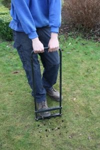 Spiking a lawn with hollow tines
