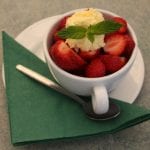 strawberries and cream in a cup